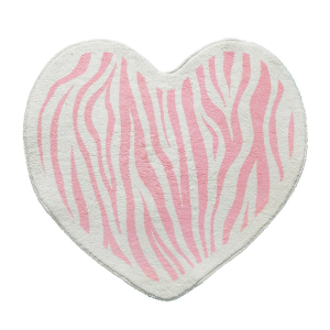 Ein herzförmiger Teppich für ein Mädchenzimmer in Weiß und Rosa mit einem Zebramuster.