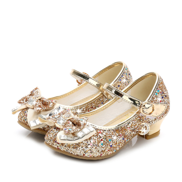 Glitter-Prinzessinnenschuhe mit Fliege für Mädchen in Gold mit weißem Hintergrund
