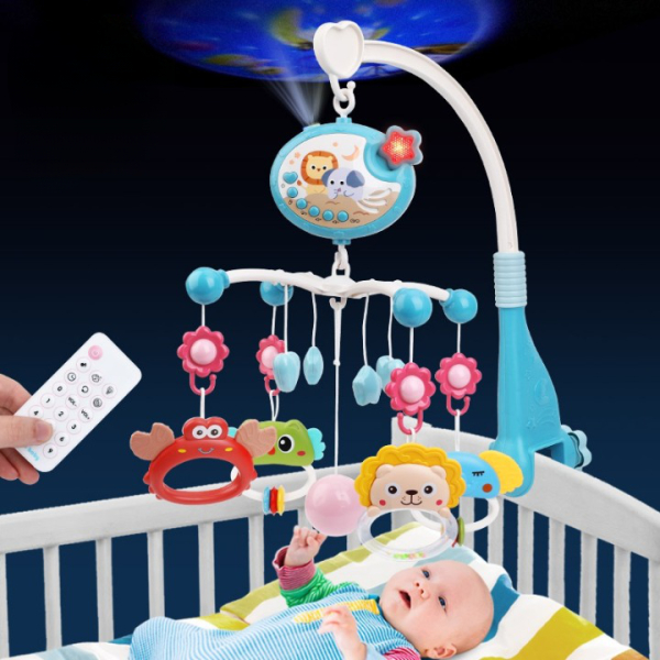 Musikalisches Mobile für die Wiege eines Baby-Mädchens mit einem dunkelblauen Hintergrund und einem Baby in seiner Wiege